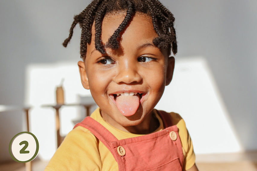 Little Brushies electric toothbrush for babies and children stick tongue out toddler brushing teeth 
